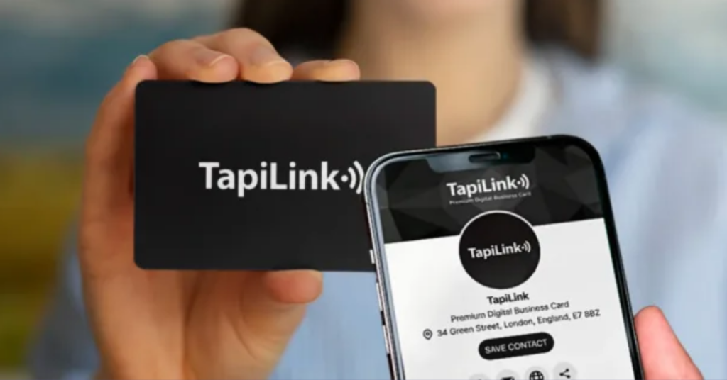 Person holding a TapisLink NFC business card while a phone displays the digital business card interface, showing contact information and social links.