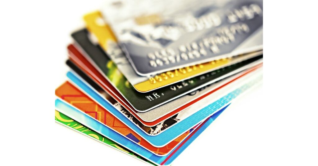 Stack of colorful plastic cards showcasing common materials used in loyalty, bank, and ID cards.